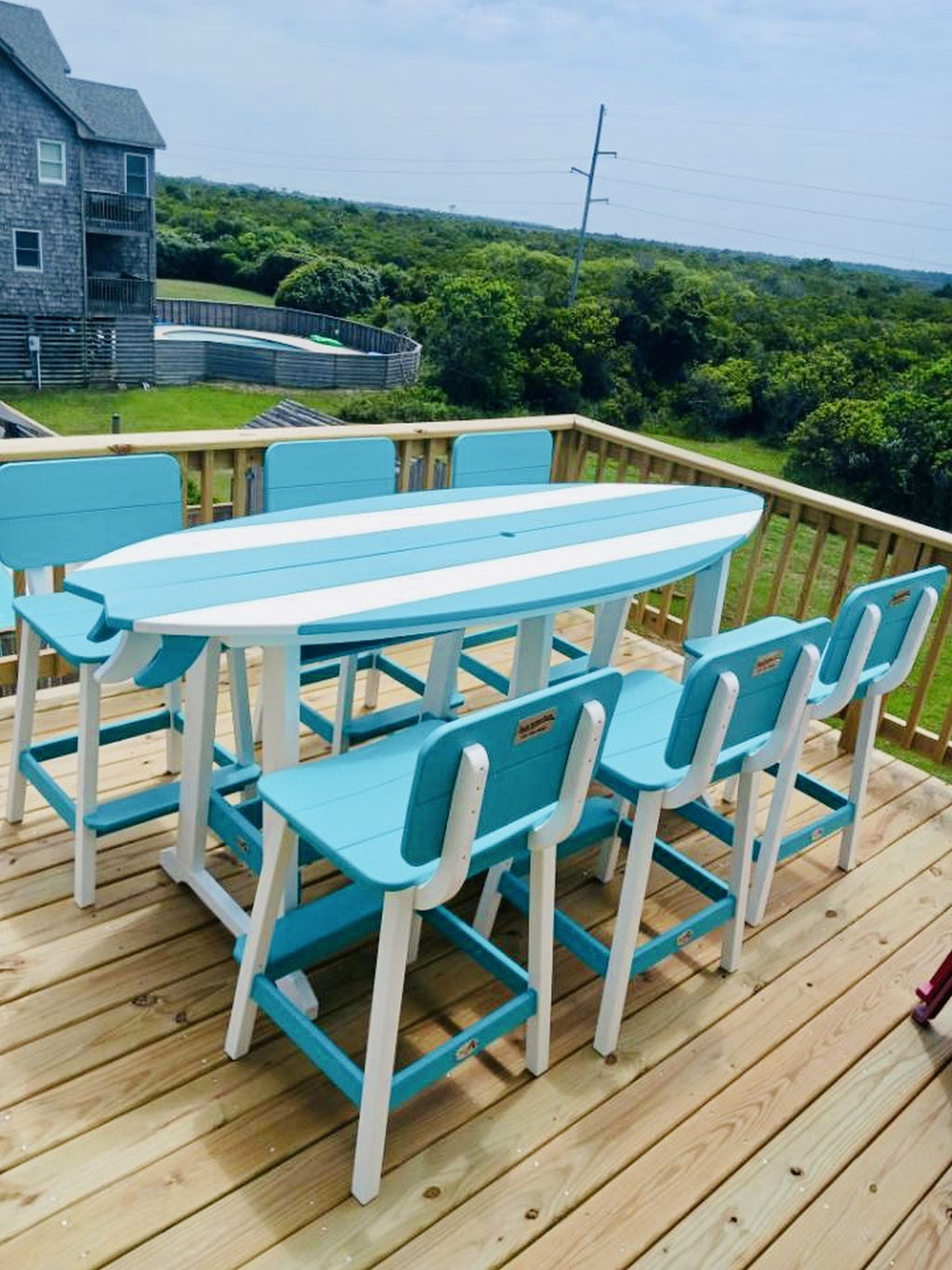 Amish made surfboard shaped outdoor table crafted from durable poly lumber, high-quality outdoor furniture designed for style and longevity